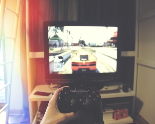 Detail of contemporary gaming controller and technology display