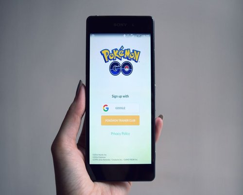 Smartphone displaying a fictional mobile game interface during a LootChampionsCrown Australian gaming technology exhibition